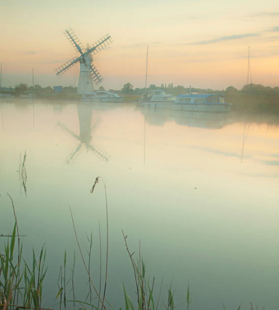 istock northfolk broads misty morning windmill 137192996
