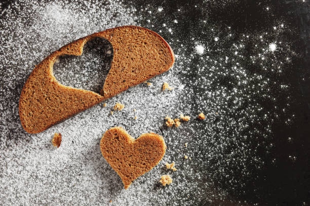 Big baked heart lies on baking paper