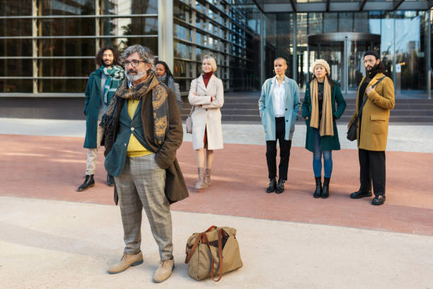 istock Man ready for business trip near colleagues 1371931991