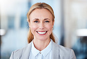 istock Portrait of a confident mature businesswoman working in a modern office 1371934582