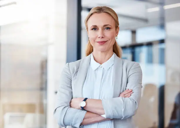 Photo of Portrait of a confident mature businesswoman working in a modern office