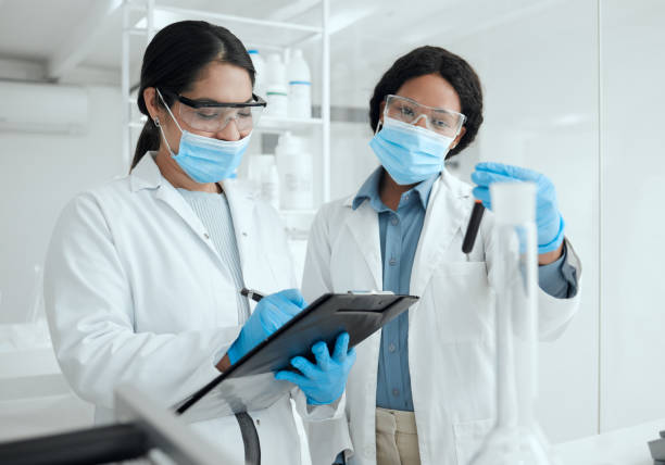 istock Shot of two female scientists reviewing a sample together while making notes 1371935211