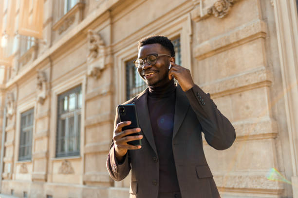 istock Businessman typing an e-mail on his way to the office 1371936111