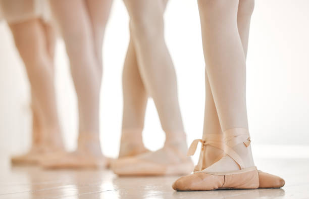 istock Shot of a group of unrecognisable ballet dancers practicing their routine in a dance studio 1371936915