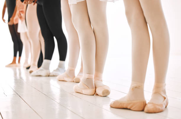 istock Shot of a group of unrecognisable ballet dancers practicing their routine in a dance studio 1371936916