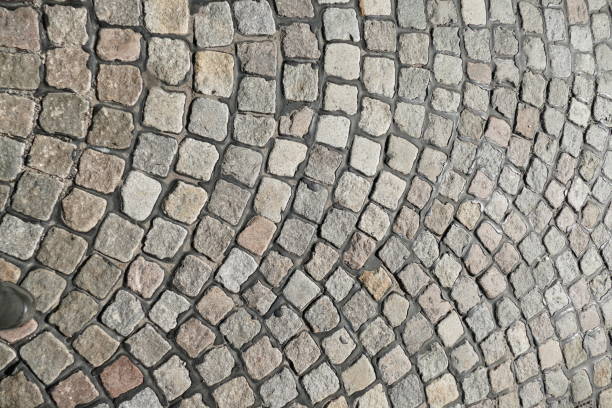 istock Grey coptic pavement with curves, paving stones, Germany, Europe 1371937112