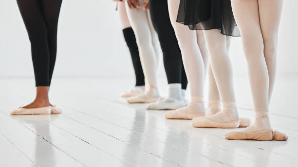 istock Shot of a group of unrecognisable ballet dancers practicing their routine in a dance studio 1371937905