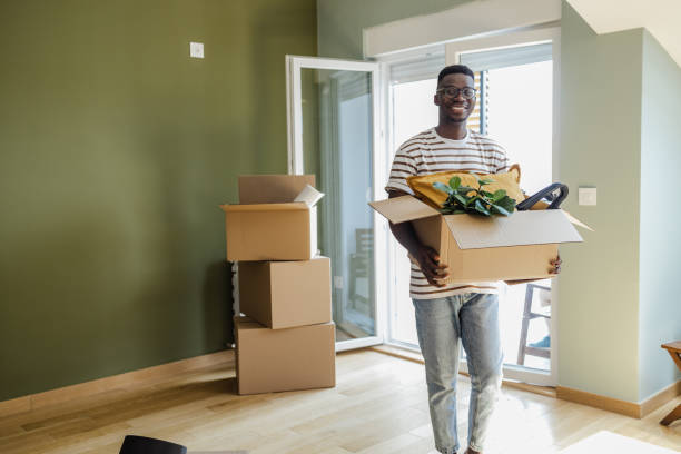 istock Young man moving into new apartment 1371938430