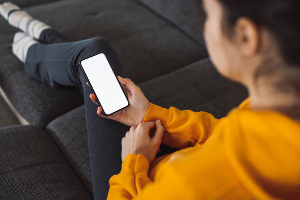 istock Unrecognizable woman looking at her phone 1371943726