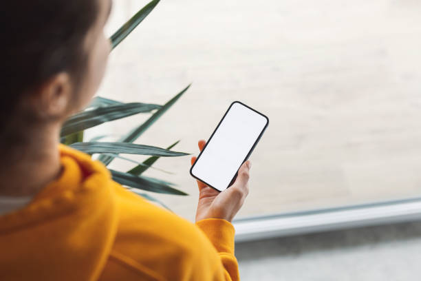 istock Unrecognizable woman looking at her phone 1371943747