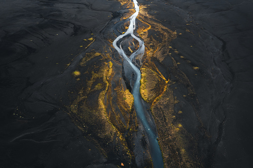 River flowing through the majestic colorful Icelandic landscape.