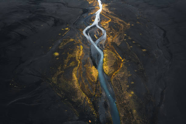 Iceland From Above River flowing through the majestic colorful Icelandic landscape. flowing photos stock pictures, royalty-free photos & images