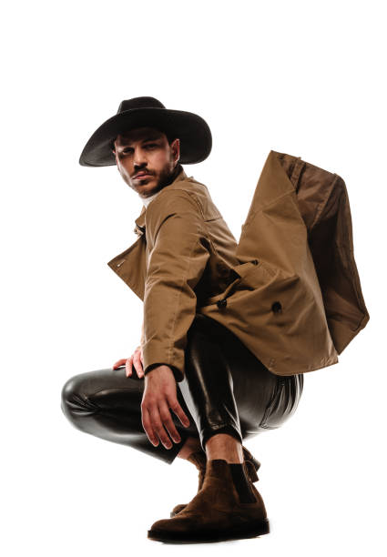 istock Attractive trendy man wearing black hat 1371945189