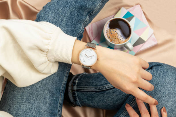 istock woman looking at her watch 1371945458