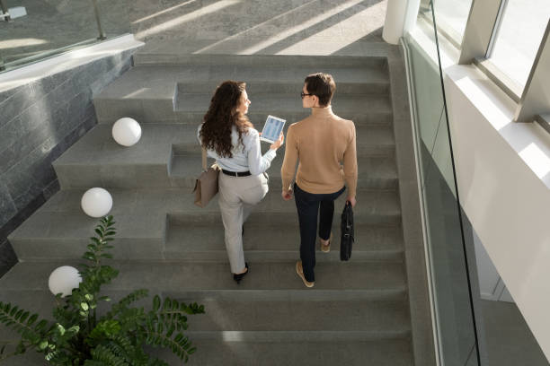 istock Two young confident managers of high tech company having discussion 1371947070