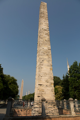 Istanbul, Turkey - July 19, 2021: The Constantine Obelisk in the historical Sultanahmet Square. Tourism, Istanbul and history concepts. Vertical close-up.