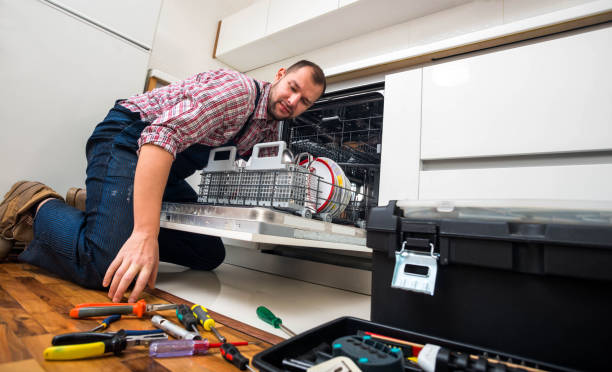 istock Handyman repair dishwasher in  the kitchen 1371949575