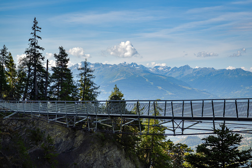 Suspension bridge on walking trail near Crans Montana in canton of Valais in Switzerland