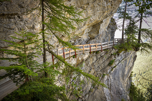 Walking trail on the cliff following historic irrigation channel close to Crans Montana is only for people without fear from heights