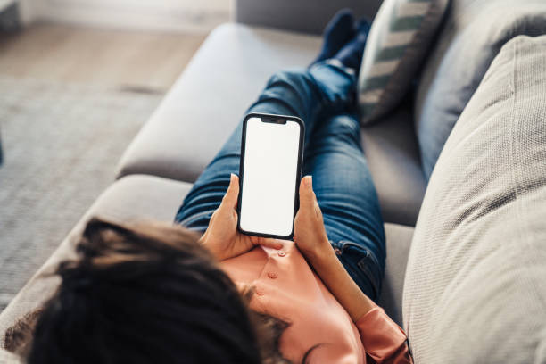 istock Woman using cellphone at home 1371954837