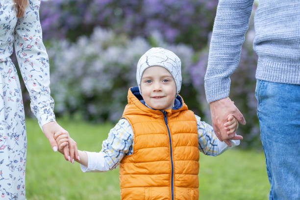 istock Son holding mother and father for hands. 1371955067