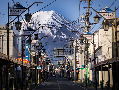 The view of the main street of Fujiyoshida town with the majestic Mt. Fuji in the background