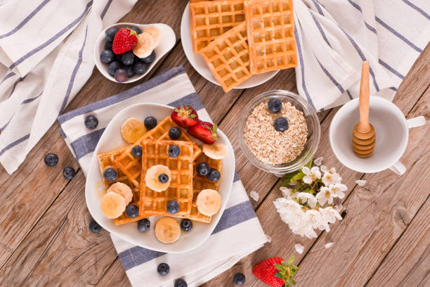 istock Waffles with blueberries, bananas and honey. 1371955676