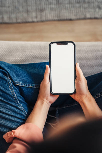 istock Woman using cellphone at home 1371955720