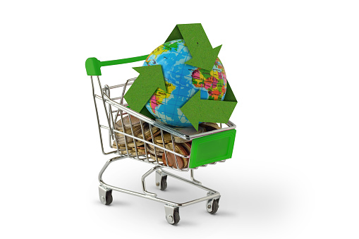 Planet earth with recycling symbol on shopping cart - Concept of environmental awareness and green purchasing