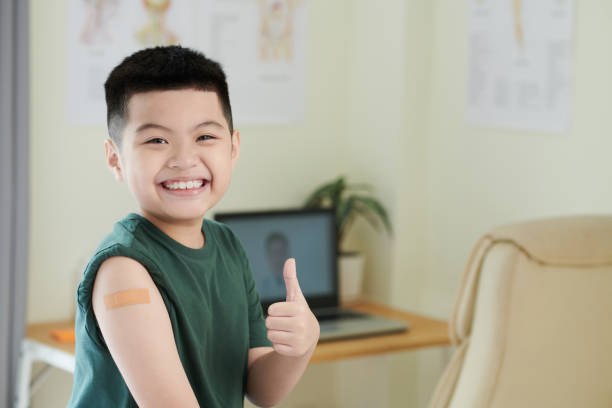 istock Boy happy with having a vaccine 1371958779