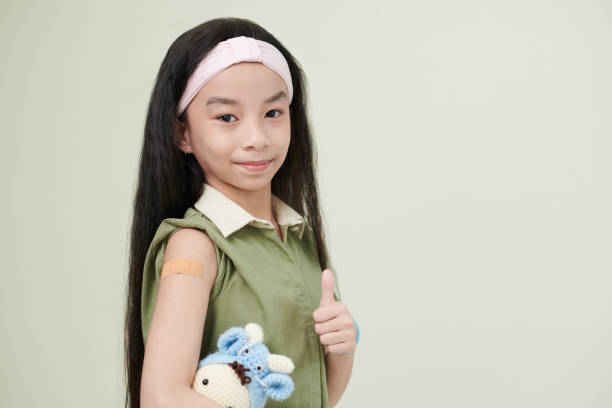 istock Asian little girl getting vaccination 1371958783