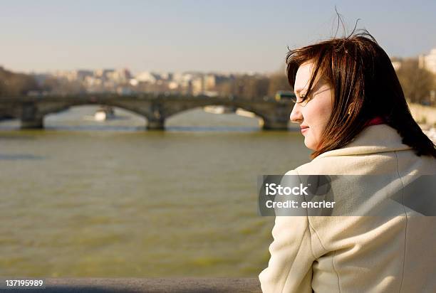 Beautiful Woman In Paris On The Seine Embankment Contemplating Stock Photo - Download Image Now