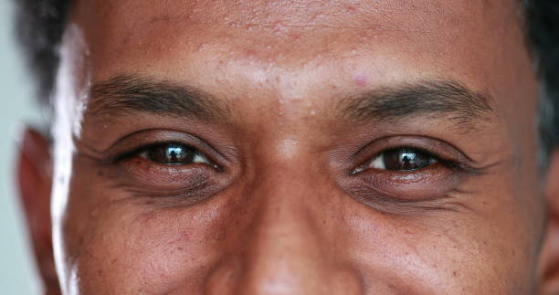 istock African man eyes close-up looking to camera smiling 1371961634