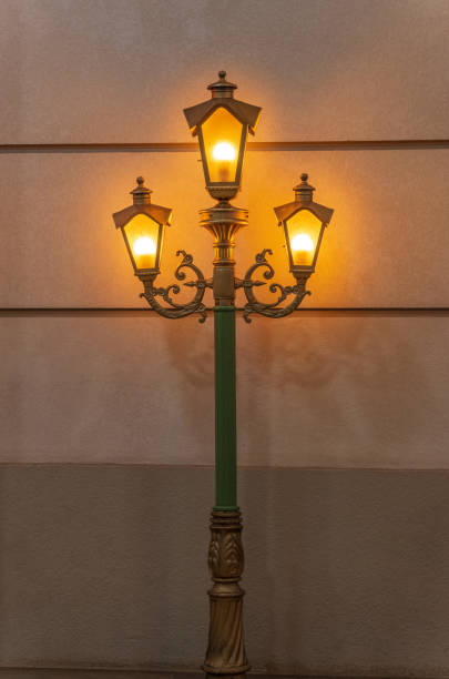 Illuminated ornate Victorian streetlamp