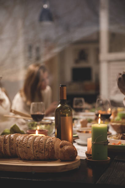 istock Bread, wine and candles to make a dinner party more enjoyable 1371963159
