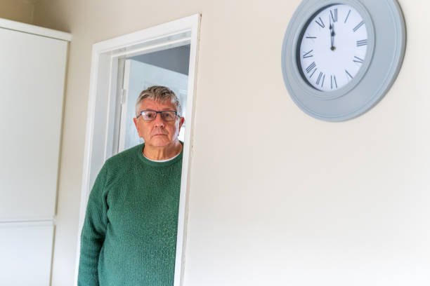 istock Senior Caucasian man peering around doorway 1371963171