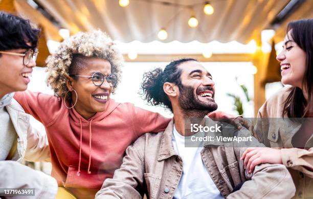 Multicultural Friends Having Fun At Travel Venue Location Life Style Concept With Happy Guys And Girls Spending Time Together College Students On Spring Break Vacations Bright Backlight Filter Stock Photo - Download Image Now