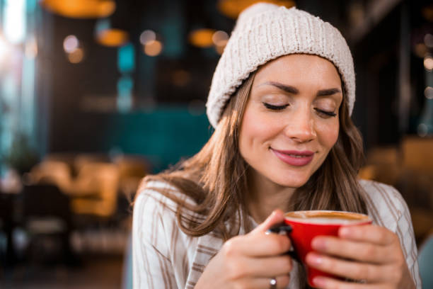 istock Cute young woman starting her day with warming coffee. 1371963554