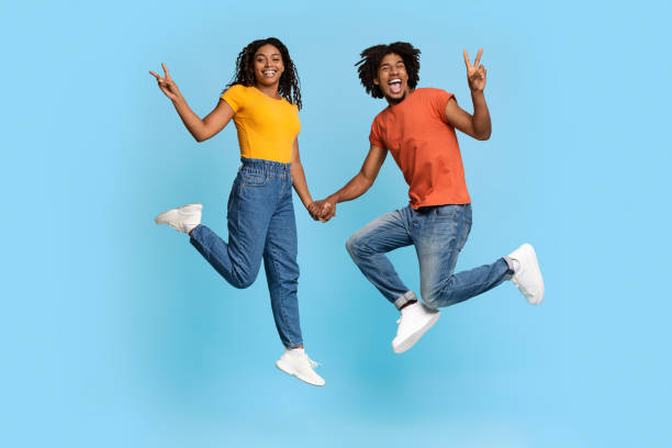 istock Happy african american lovers gesturing on blue 1371965934
