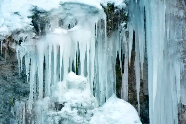 Photo of Ice stalactite on rock freeze zoom pointed shape