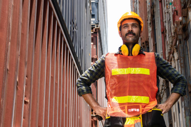 istock Portrait of male container worker standing in cargo box looking forward. men at work. logistic employee. copy space 1371968189