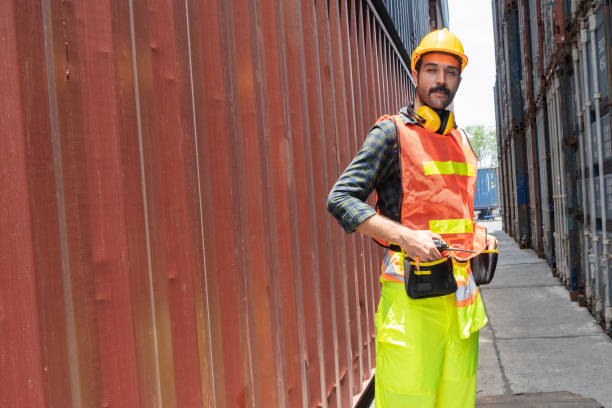istock Portrait of male container worker standing in cargo box looking forward. men at work. logistic employee. copy space 1371968417