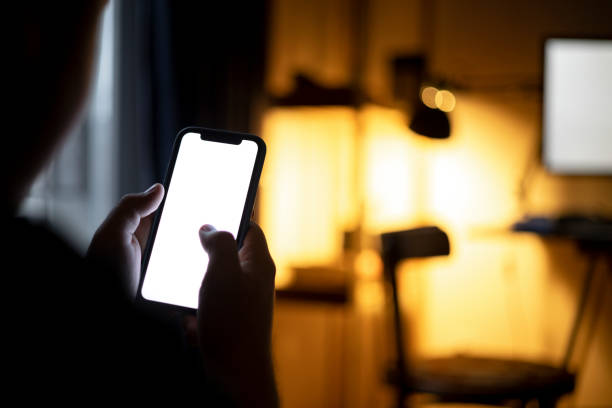 istock High angle view of an unrecognizable Caucasian man using a smart phone at home 1371969043