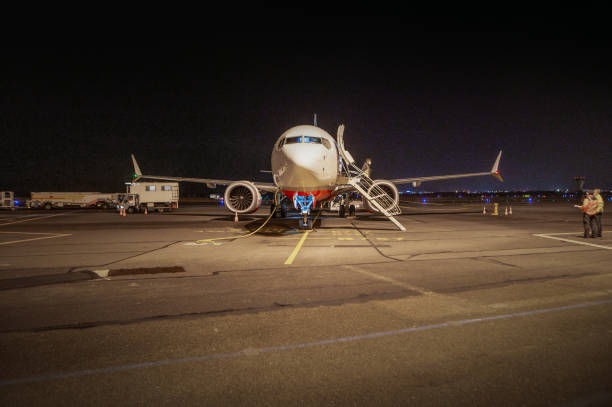 istock Airplane on airport tarmac at night 1371969054