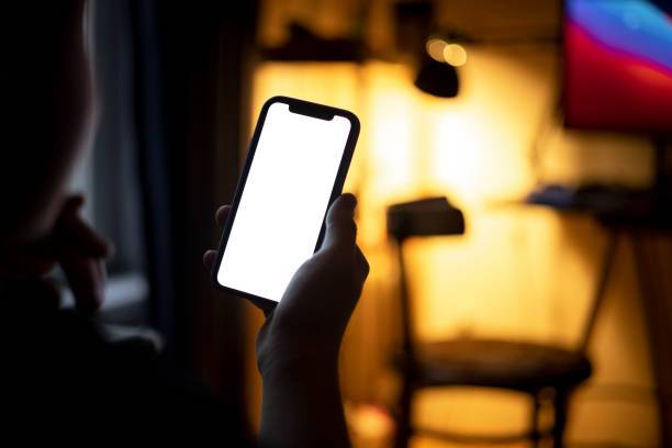 istock High angle view of an unrecognizable Caucasian man using a smart phone at home 1371969108