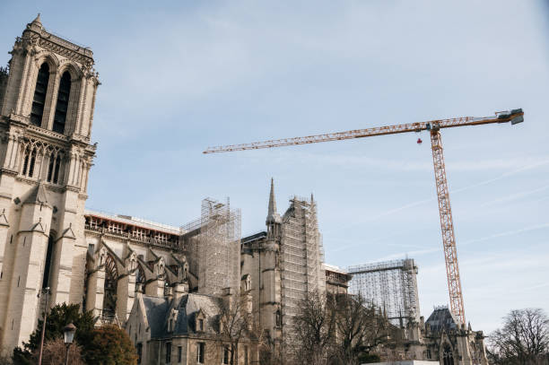 istock Construction crane on Notre Dame Cathedral in Paris 1371969589