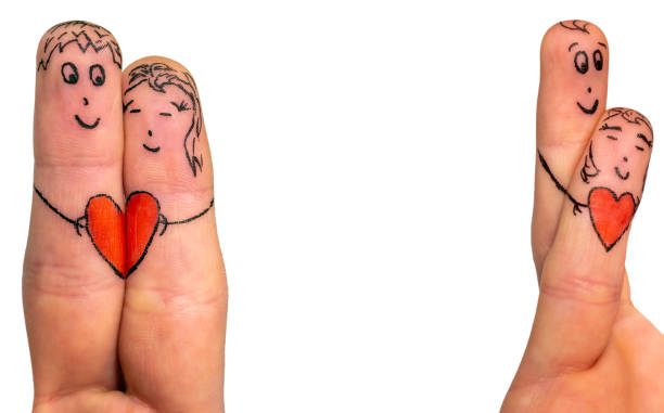 Two lovers funny painted as finger figurines on white background