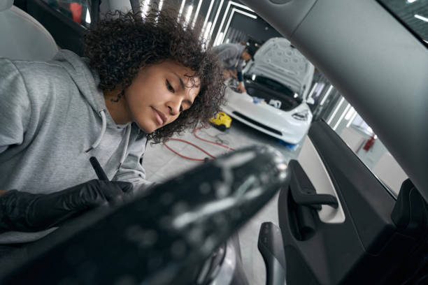 istock Concentrated detailer brushing dirt off vehicle interior surfaces 1371972476
