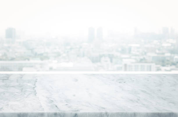 istock Selective focus.Marble table top on blur abstract city view background. 1371973712