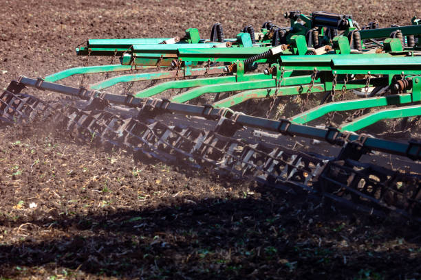 istock Versatile cultivator with disk, cultivate, harrow tools for secondary tillage - agricultural preparation of soil by mechanical agitation of various types, such as digging, stirring, and overturning. 1371974264